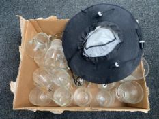 A box of Guinness pub glasses and hat