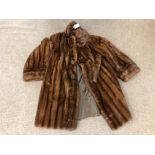 A lady's brown fur coat, 3/4 length, with "J.R.L" monogram embroidered to lining.