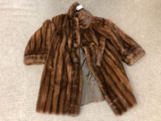 A lady's brown fur coat, 3/4 length, with "J.R.L" monogram embroidered to lining.