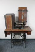 A Singer treadle sewing machine in oak table together with The Douglas clothes press