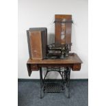 A Singer treadle sewing machine in oak table together with The Douglas clothes press