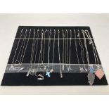 A collection of seventeen sterling silver necklaces