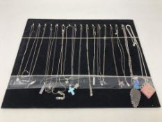 A collection of seventeen sterling silver necklaces