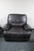 A brown leather electric reclining armchair