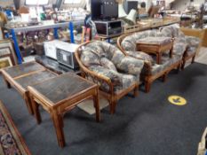 A six piece cane conservatory suite - two seater settee, two chairs, footstool,