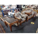 A six piece cane conservatory suite - two seater settee, two chairs, footstool,