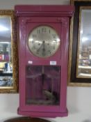 An early twentieth century painted wall clock with silvered dial,