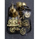A tray of brass ware, ship's bell, hand bell, ornamental swords,