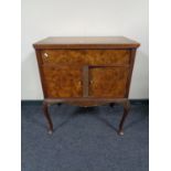 A walnut gramophone cabinet on cabriole legs