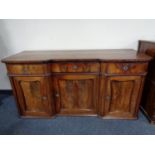 A late nineteenth century mahogany triple door inverted breakfronted sideboard