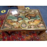 A brass bound coffee table depicting a map of the world