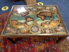 A brass bound coffee table depicting a map of the world