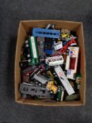 A box of play worn die cast and plastic vehicles