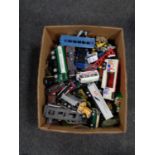 A box of play worn die cast and plastic vehicles