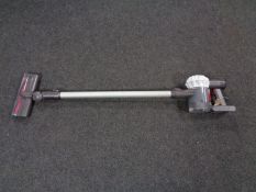 A Dyson V6 cord free electric vacuum together with a box of wall mounting bracket,