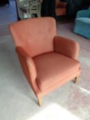 A mid century Danish armchair in corded buttoned fabric