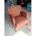 A mid century Danish armchair in corded buttoned fabric