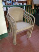 Four stacking rattan armchairs