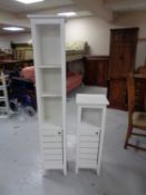 Two sets of bathroom shelves fitted with cupboards beneath