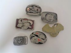 A box of six assorted metal belt buckles, Mack trucks, united states Navy,