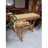 A twentieth century wooden work bench fitted with vices