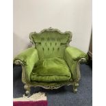 A wooden framed Rococo style armchair upholstered in green dralon fabric