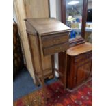 A twentieth century oak clerk's desk fitted with two drawers