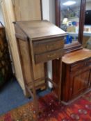 A twentieth century oak clerk's desk fitted with two drawers