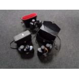 A tray of three sets of cased binoculars,