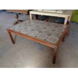 A mid century Danish teak tiled coffee table