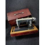 A cased Brother electric sewing machine together with a wicker sewing box