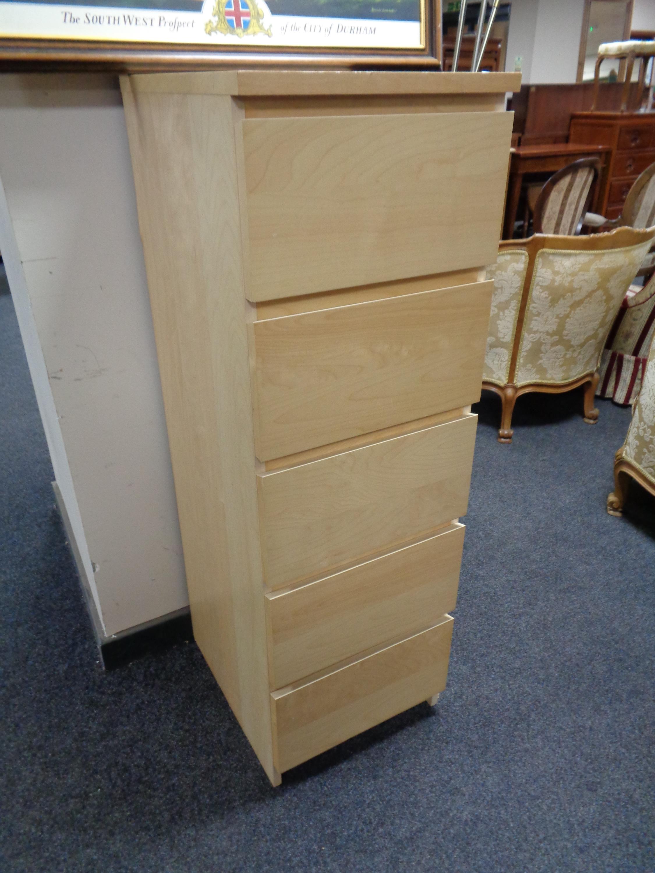 An Ikea beech five drawer chest