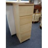 An Ikea beech five drawer chest