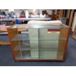 A twentieth century glass shop display cabinet