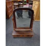 An antique mahogany toilet mirror fitted with two drawers