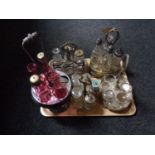 A tray of five antique plated cruet stands and assorted cruet bottles