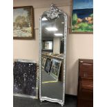 A silvered cheval mirror