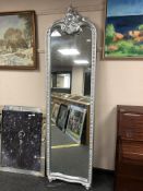 A silvered cheval mirror