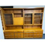 A mid century teak two piece cocktail display cabinet