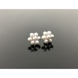 A pair of gold mounted freshwater pearl earrings