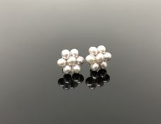 A pair of gold mounted freshwater pearl earrings