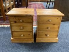 A pair of pine three drawer bedside chests