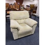 An armchair in sand coloured fabric