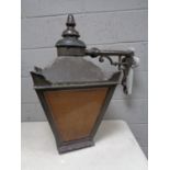 A pair of late Victorian cast iron street lights with brackets