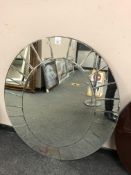 An oval all glass bevelled mirror