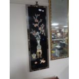 An oriental lacquered wall panel