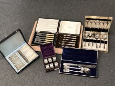 A tray of cased EPNS cutlery sets and a boxed set of six similar napkin rings