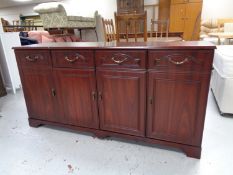 A reproduction mahogany sideboard