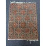 An Eastern fringed rug,