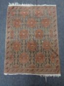 An Eastern fringed rug,